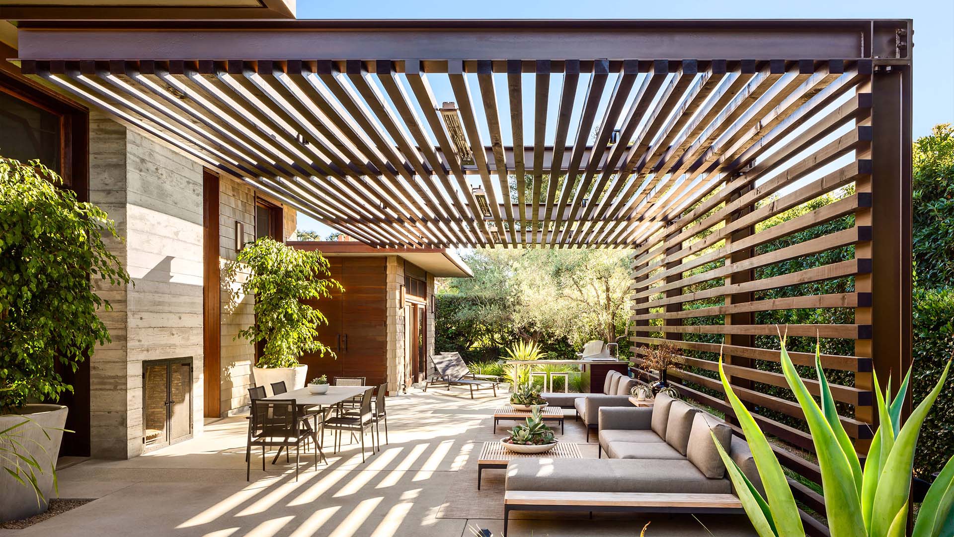 Spacious Modern pergola over an outdoor seating area.